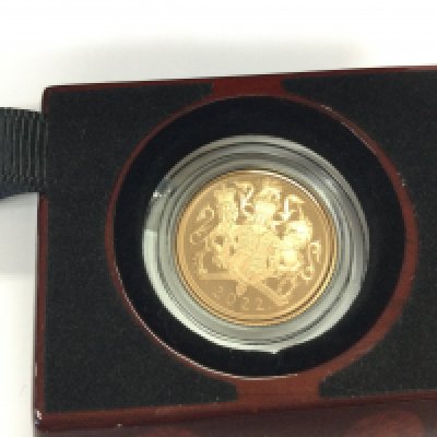 A 2022 gold proof sovereign. Postage B