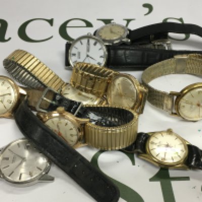 A collection of vintage watches including MuDu and Seiko examples.