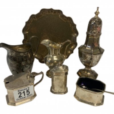 Hallmarked silver articles to include a 3 footed tazza, Sugar sifter, 2 small cream jugs, 3 piece cruet set. (D)