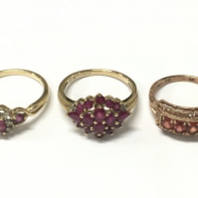 Two 9ct and one 8ct gold rings including a ruby cluster, garnet half band etc . Size Q and O. Total weight 8.8g Postage category A