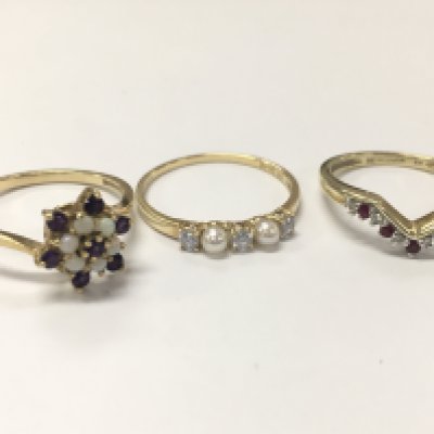 Two 9ct gold rings opal and purple gemstone set (size R) and a CZ wishbone ring (size R/Q), 14ct gold pearl and Cz set half band ring (size Q) . 5.6 g total weight. Postage category A