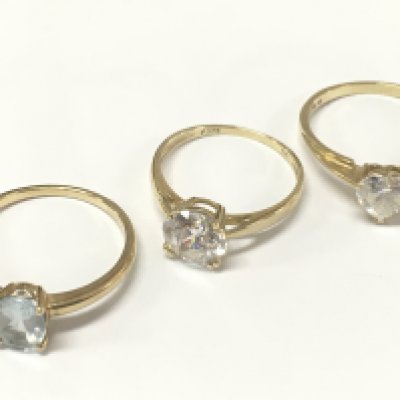 Two 9 carat gold rings - cubic zirconia set size P total weight 2g , 14ct gold heart shaped cubic zirconia ring 2.1g size R and a 9 carat aquamarine ring 1.8g size Q. Postage category A