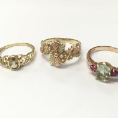 Three 9ct gold rings including a Celtic style ring (size O), Black Hills style ring (size R) , Tourmaline and pink amethyst set ring (ring size P). 7.8g total weight, Postage category A