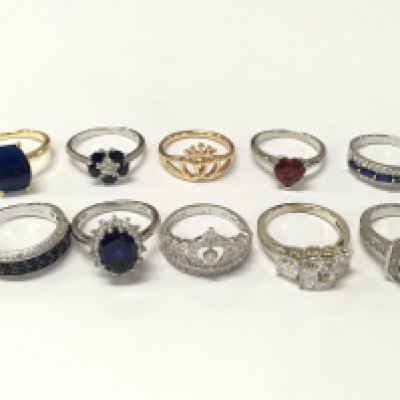 A Collection of silver rings including blue sapphire, CZ set rings etc. 35g total weight Approx . Sizes mostly P & O. Postage category A