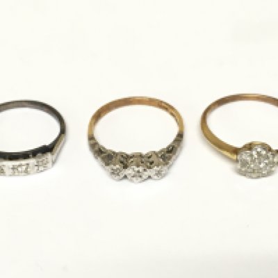 Three 18ct gold and platinum rings set with diamonds. 6g total