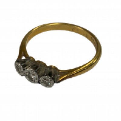 A 3 stone 18ct gold and platinum ring. Size P. (A)