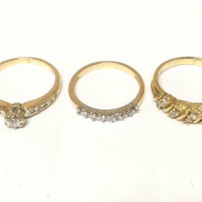 Three 14ct gold rings set with diamonds. Approximately 7.6g and sizes M M 1/2 and P Postage A