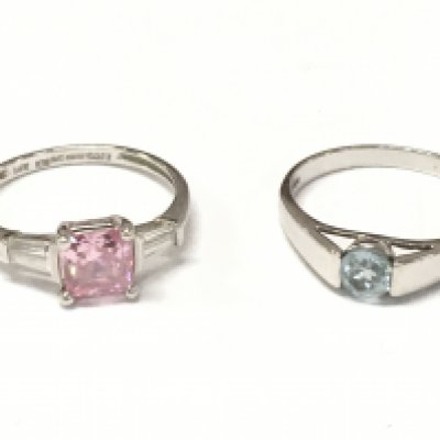A 14ct white gold ring set with cubic zirconia size Q and a 9ct white gold blue cubic zirconia ring size O. 2.3 and 2.8g Postage catA