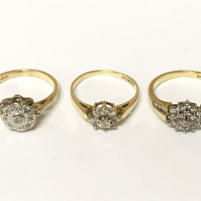 Three 18ct gold diamond cluster rings. Approximately 9.2g sizes K and M 1/2
