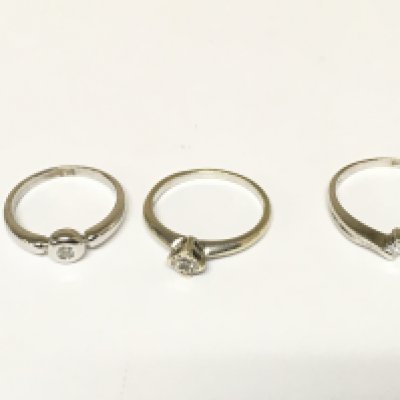 Three 9ct white gold diamond solitaire rings. Approximately 5.7g and sizes K L and N