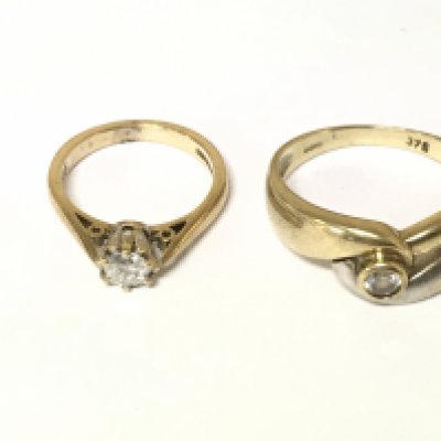 Two 9ct gold rings one set with diamond solitaire and other with white stone. Approximately 5.7g and sizes G Q