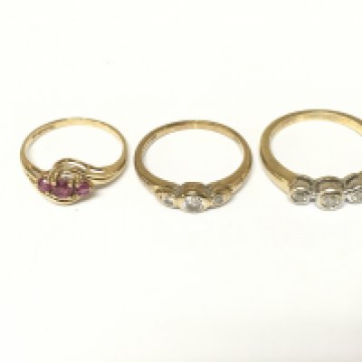 Two 9ct gold rings set with three diamonds and one 9ct gold ring set with 3 rubys. Approximately 5.5g and Sizes K L and N