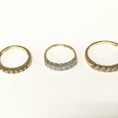 Two 9ct gold diamond half hoop rings and 1 9ct gold ring with white stones. Approximately 5.5 g and sizes K and S
