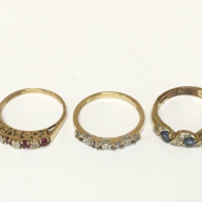 Three 9ct gold rings set with various gems including diamonds. Approximately 5.1g sizes K and K 1/2