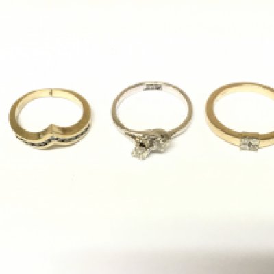 Three 9ct gold rings set with diamonds. Approximately 8.2g and sizes I N O