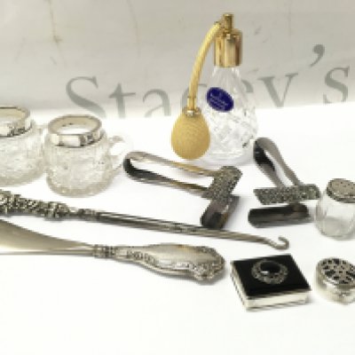 A Collection of silver including pill boxes, crochet hook, small cut glass silver topped cups and silver plated items including a rare pair of Asparagus tongs . This lot cannot be posted