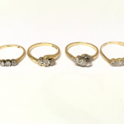 Four 18ct gold 3 stone diamond rings. Approximately 9.7g sizes J M and N