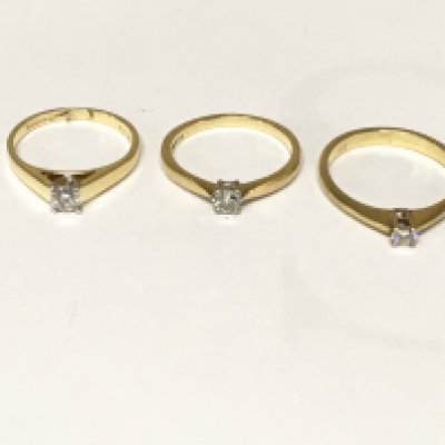 Three 18ct gold diamond solitaire rings. Approximately 7.7g and sizes L M and N