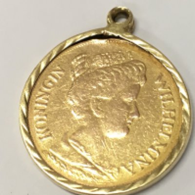 A 1912 Netherlands 5 Gulden Gold Coin in a mount, total weight 3.6g . Postage category A