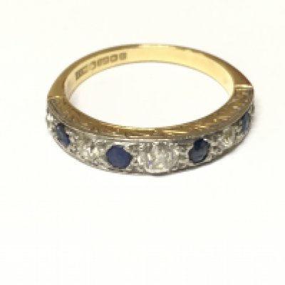 An 18ct sapphire and diamond 9 stone half eternity ring. Approximately Size R and 4.30g