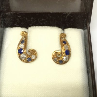 An 18ct gold pair of sapphire and diamond screw back earrings. Postage B