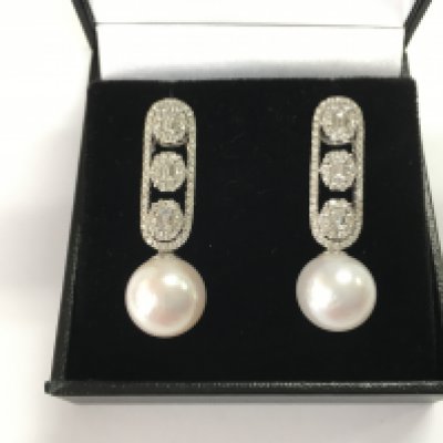 A pair of 18ct white gold long drop deco-style earrings set with cultured pearls and diamonds. Diamonds 1.28ct.
