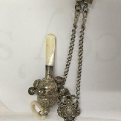 A child&#2013266057۪s silver rattle and a Victorian chatelaine.