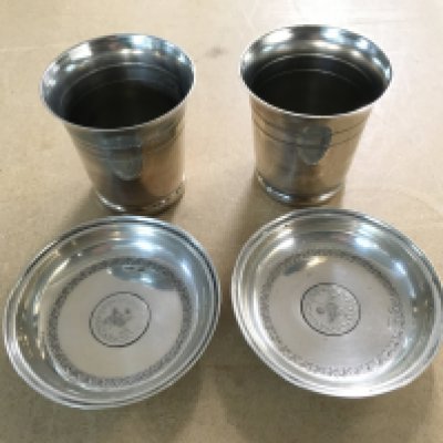 Two silver dishes (marked 800) and two silver beakers. Approximately 150g