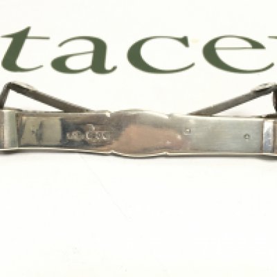 A 1894 silver double cigar cutter. Postage category A