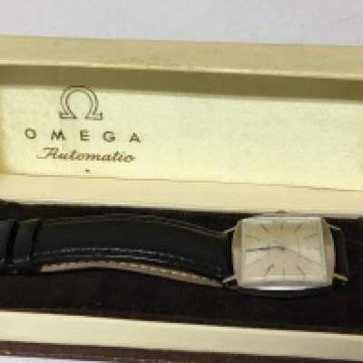 A Vintage Gents Omega Automatic wrist watch with a stainless steel cushion case watch seen working and with original box.