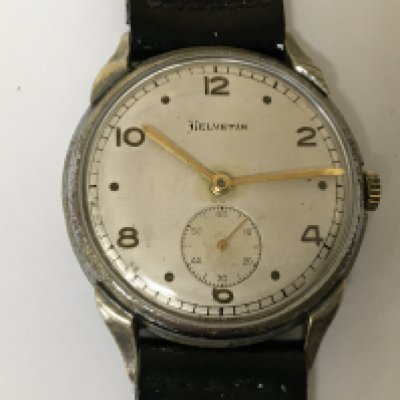 A German Third Reich Military watch maker Helvetia the dial with dot and even number markers second subsidiary dial the case with serial number D40216H watch seen working.