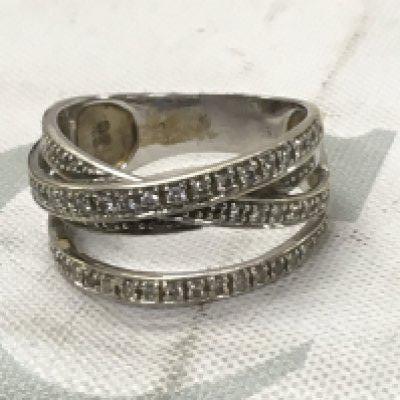 A 18 ct gold diamond cross over ring 5.5 grams size M .