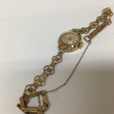 A ladies 9carat gold Rotary watch with an open repeat pattern 9carat gold attached bracelet weight 13g