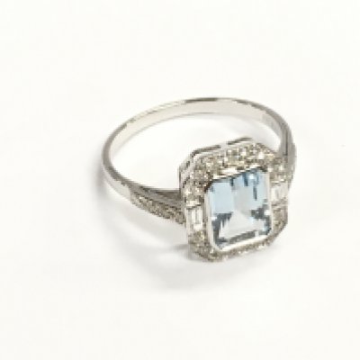 18ct white gold art deco style aquamarine ring with round and baguette cut diamonds. Aquamarine 1.42ct and diamonds 0.50ct. Size O
