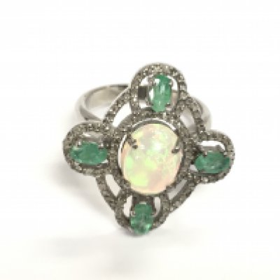 Silver dress ring set with an oval cabochon opal oval emeralds and diamonds. Opal 1.5ct emeralds 1ct and diamonds 0.60ct approximately. Size P