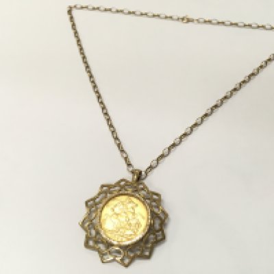 A 1907 full sovereign with mount and chain , 16.2g total weight. Postage category A