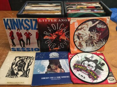 Eight record cases of 7" singles and EPs by various artists including The Kinks, Siouxsie & The Banshees, David Bowie, The Courteeners and many more.