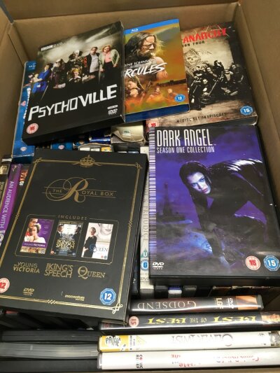 Four boxes of DVDs and BluRays.