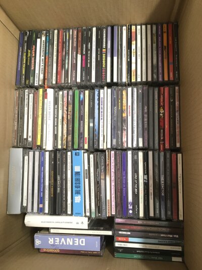 Three boxes of CDs by various artists including Arctic Monkeys, Aerosmith, Oasis, Paul Weller and many more.
