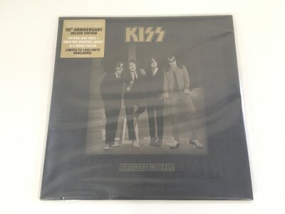 A deluxe limited edition Kiss Dressed To Kill picture disc with inserts.