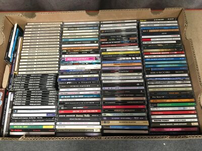 A box of rock, pop and jazz CDs.