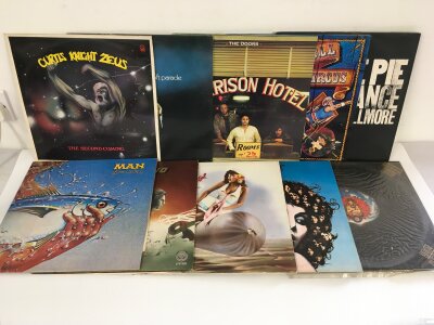 Two bags containing twenty rock LPs by various artists including The Doors, Man, Curtis Knight Zeus and others.