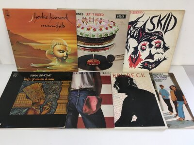 Fifteen LPs by various artists including Bruce Springsteen, The Rolling Stones, Nina Simone and others.