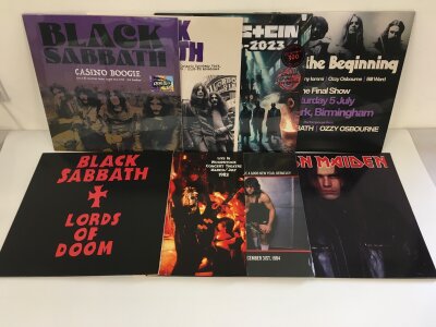 Eight heavy rock LPs, some sealed, by various artists including Iton Maiden, Slayer and others  plus some 7" singles including coloured vinyl examples.