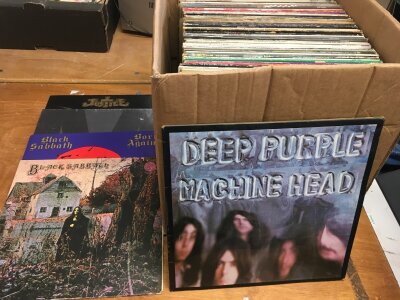 A box of LPs comprising mainly rock and heavy metal artists including Black Sabbath, Deep Purple, Whitesnake and many more.