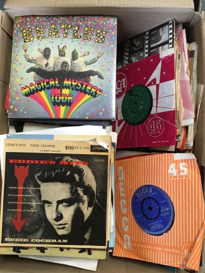 A box of 7" singles, EPs and demo discs by various artists form the 1950s onwards including The Beatles, Eddie Cochran, Jimi Hendrix and many more.