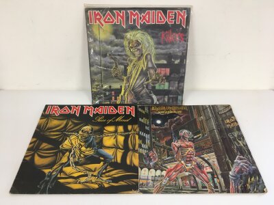 Three Iron Maiden LPs comprising Killers, Piece Of Mind and Somewhere In Time. Records in need of a deep clean.