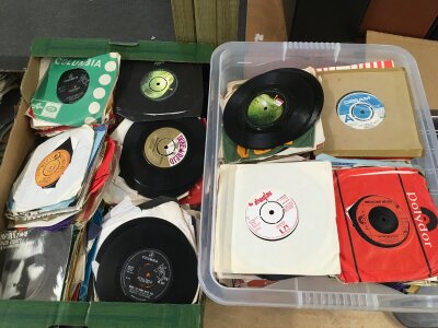 Two boxes of 7" singles by various artists including The Beatles, The Stranglers, David Bowie and others.