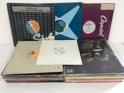 A bag containing various funk, soul and disco LPs and 12" singles.