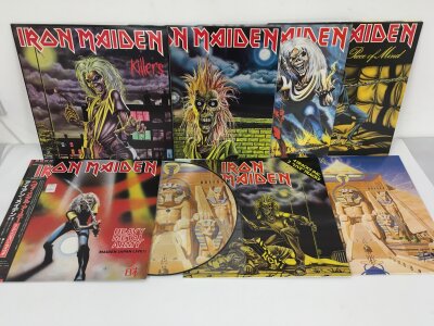 Eight Iron Maiden LPs and 12" singles including Killers, a Powerslave picture disc, Japanese import of Heavy Metal Army - Maiden Japan Live!! and others.